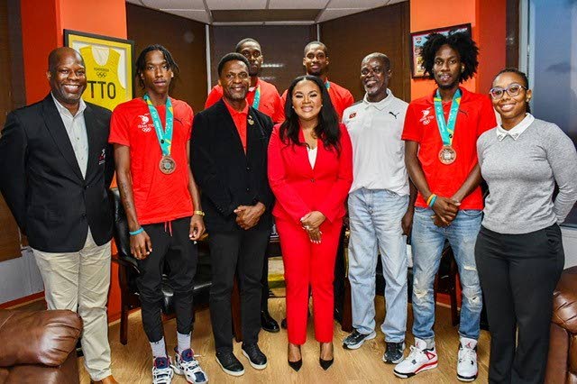 Minister of Sport and Community Development Shamfa Cudjoe-Lewis, middle, during a courtesy call with local basketballers, coaches and sport officials. Head of sport development at SporTT Justin Latapy-George, from left, player Ahkeel Boyd, team manager/physio Wayne Samuel, team captain Moriba DeFreitas, player Chike Augustine, coach Christopher Jackson Charles, player Ahkeem Boyd and sport development officer at SporTT Courtnee-Mae Clifford. - courtesy Ministry of Sport and Community Development (Image obtained at newsday.co.tt)