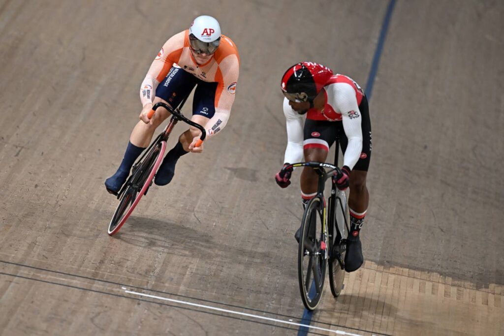 Netherland's Jeffrey Hoogland, left, stalks Trinidad and Tobago's Nicholas Paul in their 1/8 final of the men's Elite Sprint at the Sir Chris Hoy velodrome during the 2023 UCI Cycling World Championships in Glasgow, Scotland. - (Image obtained at newsday.co.tt)