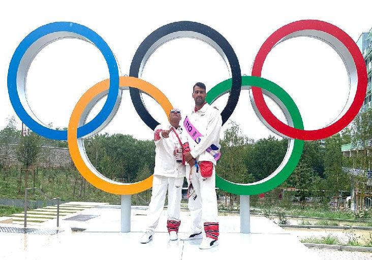 OLYMPIANS: Dylan Carter, right, and his coach, Dexter Browne, in front of the Olympic rings before last Friday’s Olympic Games opening ceremony here in Paris, France. Carter and Michelle-Lee Ahye were the flagbearers for Trinidad and Tobago. (Image obtained at trinidadexpress.com)