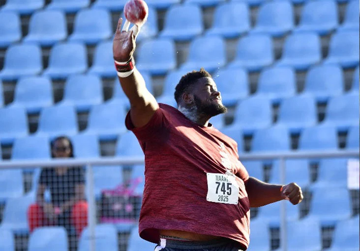 DOUBLE TROUBLE: Christopher Crawford competes in the NAAATT/NGC National  Senior Championship men’s shot put event at the Hasely Crawford Stadium, Mucurapo, last Saturday. Crawford won the shot put, and followed up with victory in the men’s discus on Sunday. —Photo: DENNIS   ALLEN for @TTGameplan (Image obtained at trinidadexpress.com)