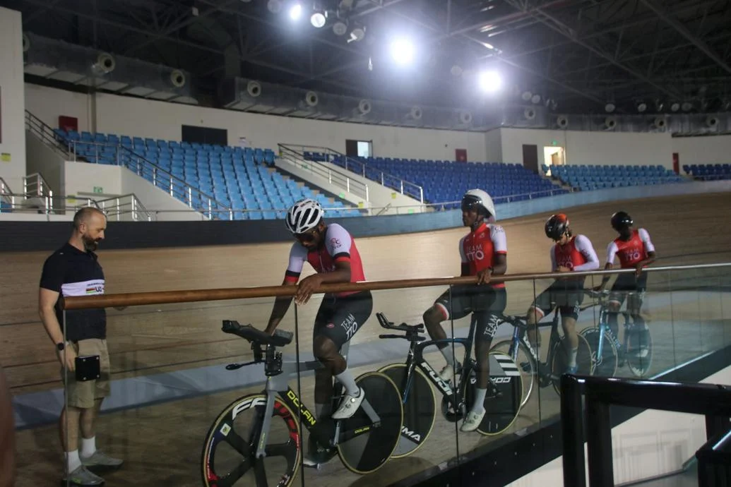 DOWN TO BUSINESS: UCI Satellite Centre Development Manager James Hey, left, puts Team TTO cyclists through their paces during a training session yesterday, at the National Cycling Centre in Couva, which also functions as a regional UCI Satellite Centre for cycling development. —Photo courtesy SporTT (Image obtained at trinidadexpress.com)