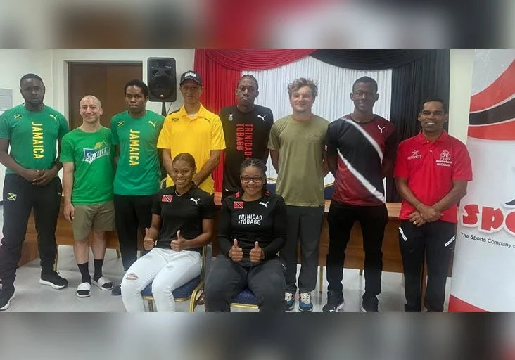READY TO ROLL: Female cyclists Phoebe Sandy, seated right, and Kyrah Williams, seated left, are among the many international cyclists who will take part in this  weekend’s events. --Photo courtesy SportTT (Image obtained at trinidadexpress.com)